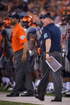 Shafer yells toward the field as defensive backs coach Fred Reed stands in the background.