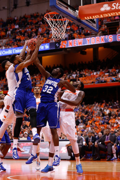 (From left to right) McCullough, Pressley, Adams and Christmas struggle for a rebound.
