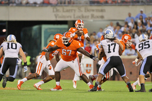 Kalon Davis (67) is Clemson's starting right tackle and leads its offensive line into the Tigers' matchup with Syracuse on Saturday. As for his quick feet despite his large frame, that comes from the soccer field. 