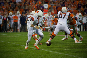 AJ Long fumbles the ball in Syracuse's 16-6 loss to No. 21 Clemson Saturday night in Death Valley. The freshman quarterback threw two interceptions and sustained four sacks in the game.
