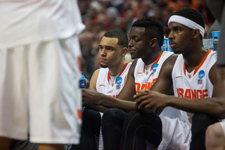 Ennis (left), Grant (middle) and Fair (right) rest on the bench during a timeout. 