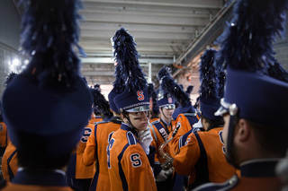 Kevin Varga, a freshman music education major and member of the Syracuse University Marching Band, prepares to step onto the largest stage on which he has ever performed.