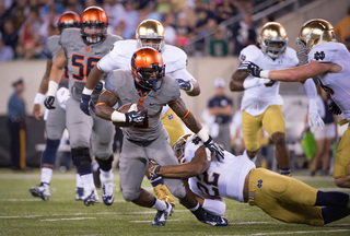Syracuse wide receiver Brisly Estime is taken down by a Notre Dame defensive back. 