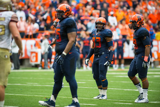 Orange middle linebacker Marqez Hodge (middle) looks to the sideline. The SU defense had trouble controlling FSU's ground game throughout the afternoon. 