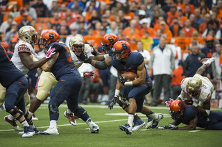 Syracuse running back George Morris carries the ball into the teeth of the Florida State defense. 