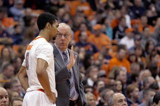 Boeheim gives instruction to forward Michael Gbinije. Gbinije had another rough night, with four points and two turnovers in 23 minutes.
