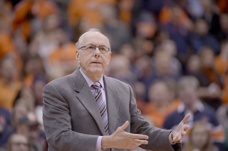 Boeheim motions with both hands toward the court. His team was 0-for-14 from 3, but still managed a 24-point win.