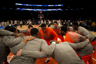 Sophomore B.J. Johnson pumps up his Syracuse teammates prior to tipoff against Iowa in Madison Square Garden. 