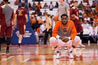 Rakeem Christmas crouches near midcourt before the Syracuse team he's been carrying takes on Boston College on Tuesday night.