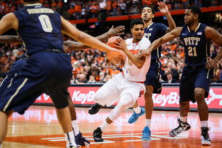 Michael Gbinije tries to split the Pittsburgh defense in the first half. 