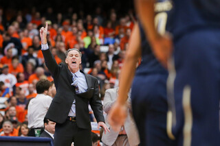 Pittsburgh head coach Jamie Dixon calls out a play to his team. 