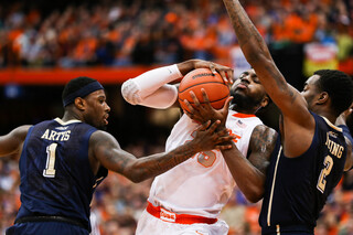 Rakeem Christmas tries to keep possession as Jamel Artis and Michael Young  look to poke it away. 