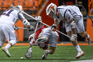 Brandon Mullins and Mike Messina double team a Cornell player and strip the ball away from him. 