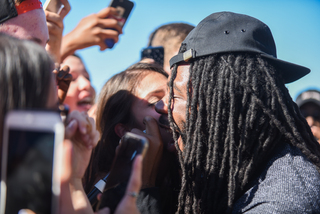 D.R.A.M. interacts with fans during his set. 