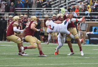 Dungey gets slammed by a Boston College defender.