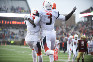 Philips (3) celebrates with Brisly Estime (1) in the end zone.