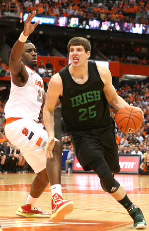 Syracuse forward Rakeem Christmas guards Notre Dame forward Tom Knight. Christmas helped slow Cooley after struggling against the forward a year.