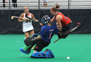 Syracuse forward Karlee Farr draws a penalty when a goalie trips her up.