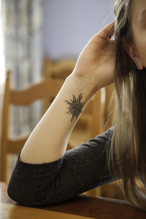 Felicia Neuhof remembers her father through her tattoo of a Celtic knot with a sunshine pattern around it. She lost her father to lung cancer when she was in high school. 