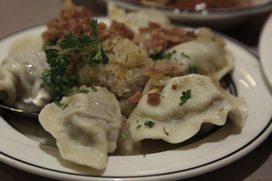 The meat pierogi from Eva’s European Sweets is packed with ground beef and is garnished with sautéed onions, sauerkraut and bacon pieces. The restaurant’s dessert choices include an orange and chocolate ganache cake and vanilla cappuccino. 