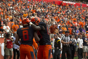 Tight end Josh Parris, right, puts his hand on wide receiver Steve Ishmael's head. Parris and Ishmael combined for eight catches and 66 yards two Saturdays ago.