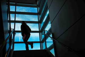 A student rushes up stairs in Whitman. Check below to find out where the school's online MBA program ranked among the best in the nation.