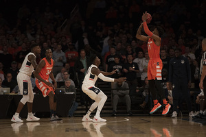 Oshae Brissett takes a corner three in Syracuse's loss.