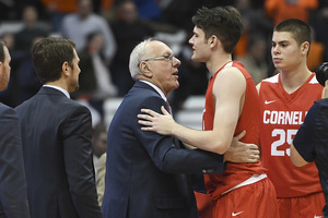 After last November’s game, Jim and Jimmy Boeheim convene at midcourt to exchange a few words. “You were close to having a good game,” Jim told his son. 
