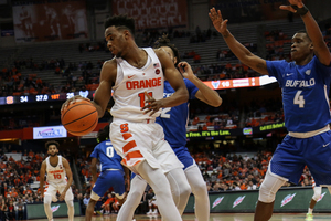 Oshae Brissett keeps the ball away from Buffalo defenders SU's win last year over the Bulls. 