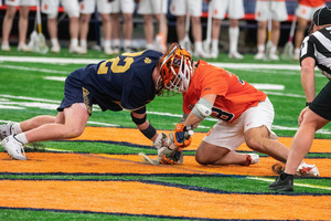 Michael Leo's goal with 12 seconds left erased a day of mistakes for Syracuse, who struggled at the faceoff X.