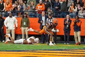 Justus Ross-Simmons reaches for the end zone in the third quarter against Virginia Tech. Ross-Simmons recorded two touchdowns in SU's comeback victory.