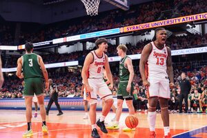 Syracuse forward Jyare Davis (right) recorded a team-high 22 points off the bench to lead the Orange to a victory over Le Moyne.