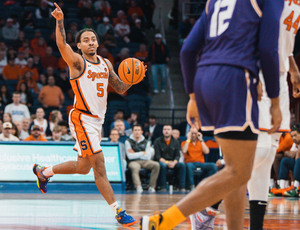 Jaquan Carlos recorded a season-high 12 assists with 14 points to help Syracuse take down UAlbany 102-85.