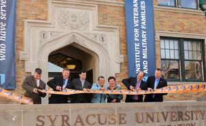 Syracuse University faculty was on-hand at the ribbon-cutting ceremony for the Institute for Veterans and Military Families, which will be housed inside University College. The institute opened in June and continues SUs long-standing tradition of assisting veterans.