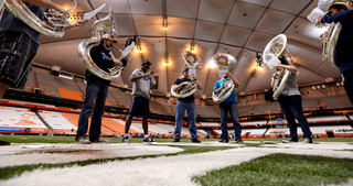 The sousaphone section practices.