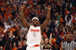 Syracuse small forward C.J. Fair celebrates his team's win over Cincinnati, 57 to 55.