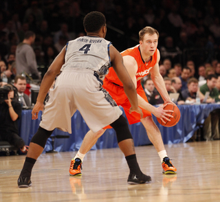 Trevor Cooney holds the ball at the point. He led the Orange in scoring in the first half.