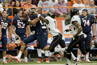 Orange wide receiver Jarrod West hauls in a pass over Wake cornerback Merrill Noel.