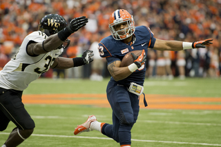 SU running back Prince-Tyson Gulley dances around a Wake Forest defender.