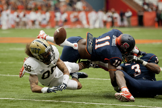 Syracuse linebacker Marquis Spruill and Eskridge converge to break up a pass intended for Pittsburgh wide receiver Kevin Weatherspoon.