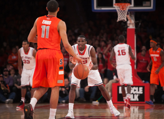 St. John's Rysheed Jordan claps and grins as the Red Storm takes a mid-game lead. 