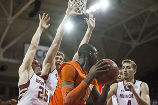 Keita surrounded by a crowd of BC defenders after grabbing an offensive rebound. 