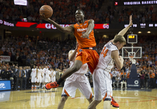 Tyler Roberson splits two Virginia defenders to finish a layup in garbage time. 