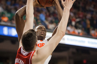 Grant goes up for a shot but is blocked by N.C. State center Jordan Vandenberg. 