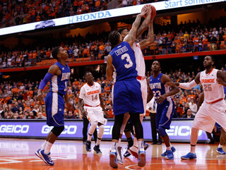 Hampton's Quinton Chievous vies for the ball against Syracuse forward Chris McCullough in the first half of the Orange's game against Hampton on Sunday in the Carrier Dome.