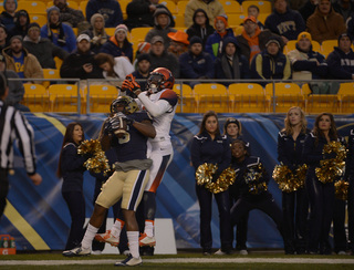 Panthers defensive back Lafayette Pitts hauls in an interception after getting himself in position in front of SU wideout Steve Ishmael.