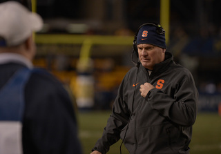 Shafer blankly looks down with his team trailing in the second half. The loss dropped the Orange to 3-8.