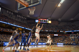 Cooney lofts up a floater in the lane with his right hand as Hamilton contests the shot.