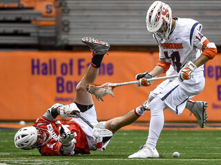 A Cornell player loses possession while fighting for ball control.