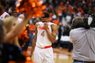 Ron Patterson wipes his face as he leaves the court after the game.